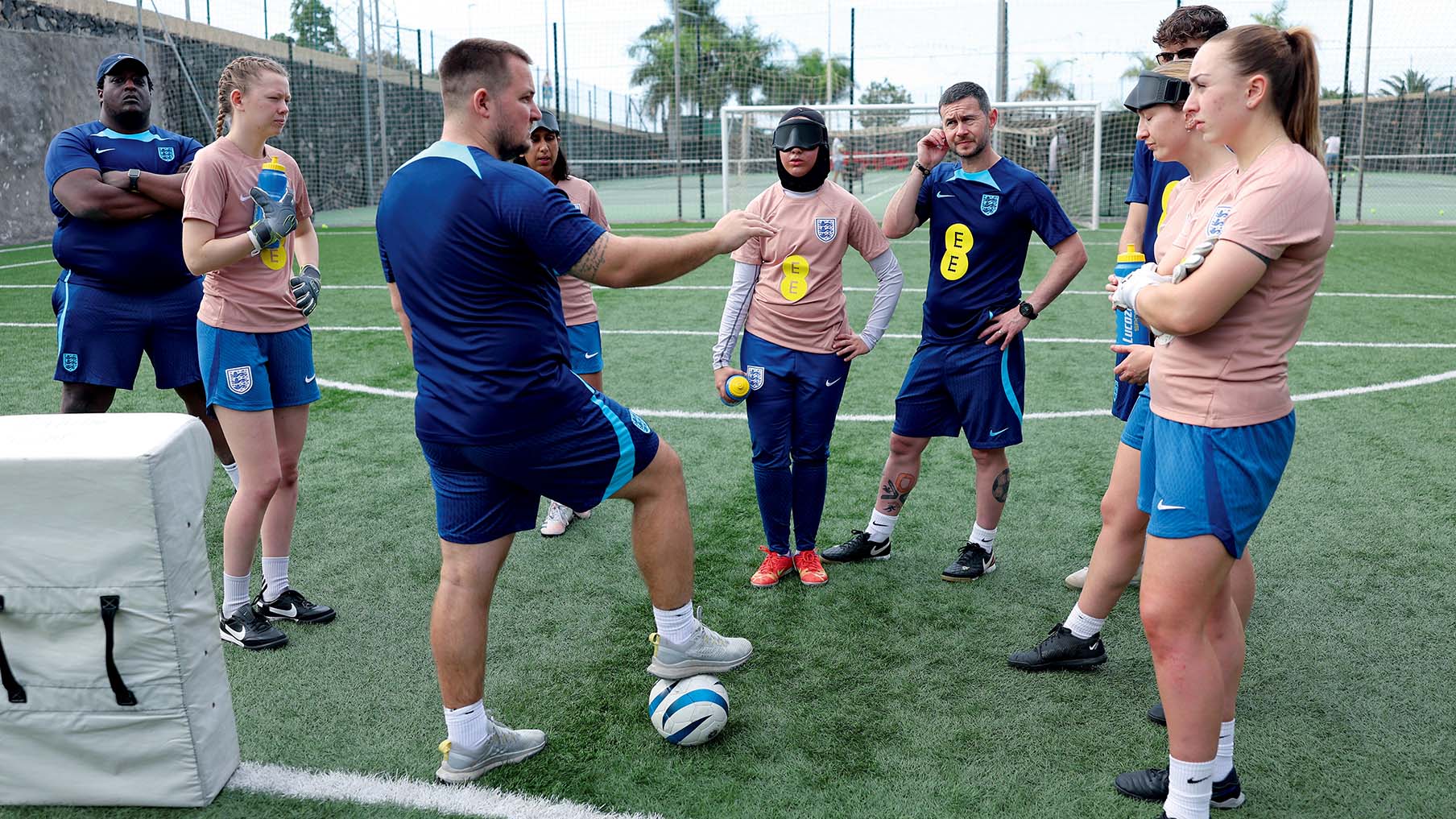 Blind footballers playing football on a football pitch.jpg