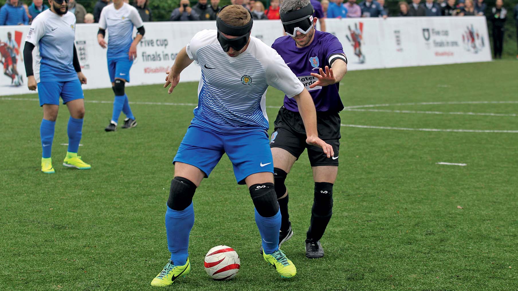 Blind footballers playing.jpg