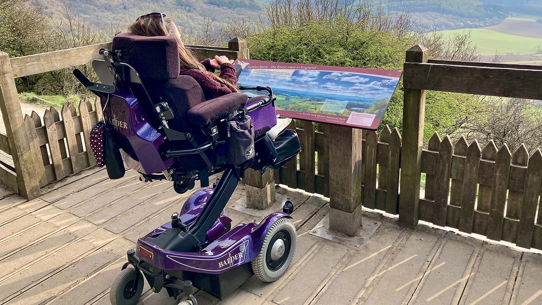 Karla looking out to a viewpoint on her wheelchair.jpg