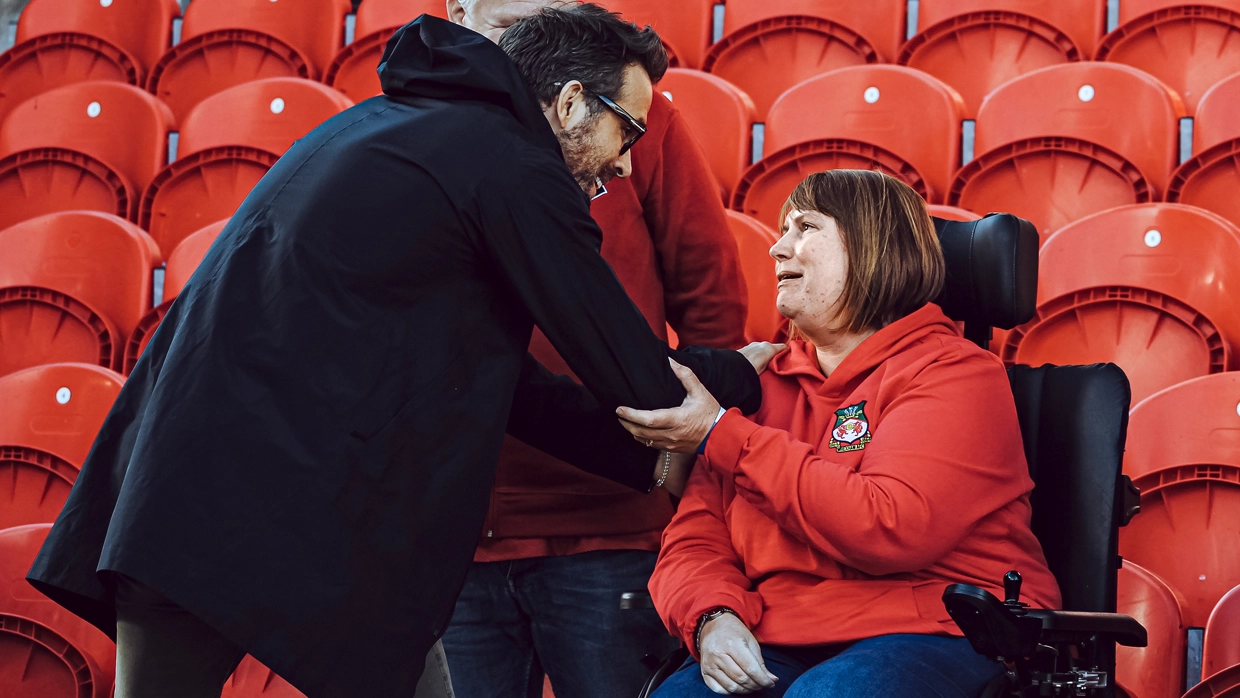 Kerry sitting on the ground.webp