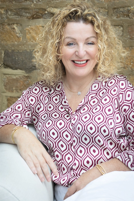 Portrait photo of Heather smiling at the camera.webp