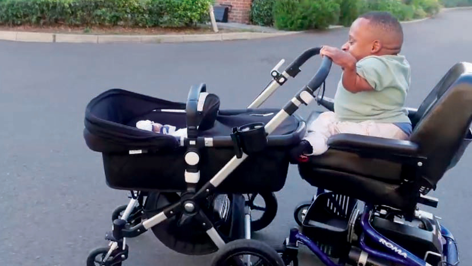 Winston Clements with a pushchair.jpg