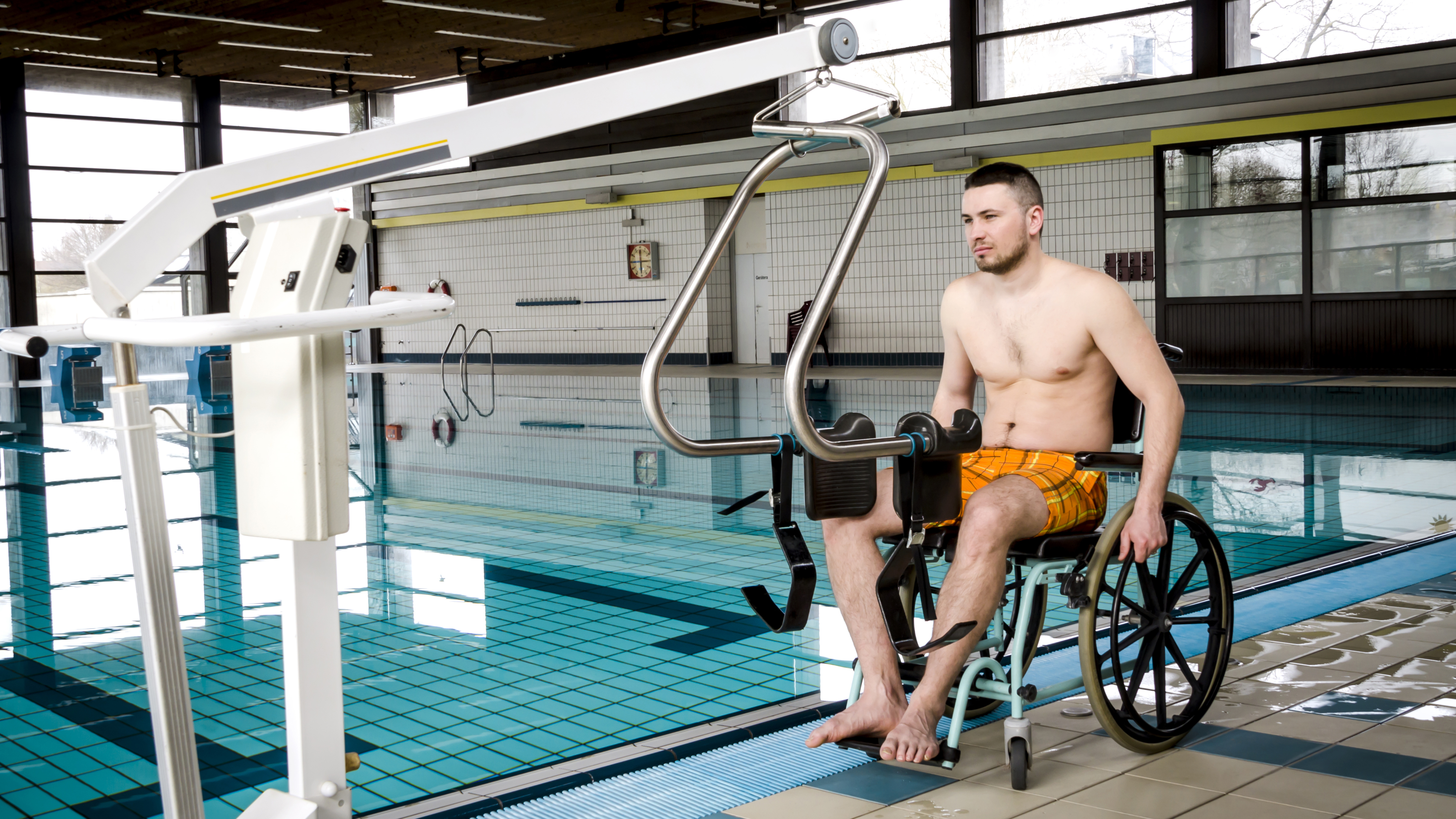 a-male-wheelchair-user-approaching-an-accessible-swimming-pool.jpg