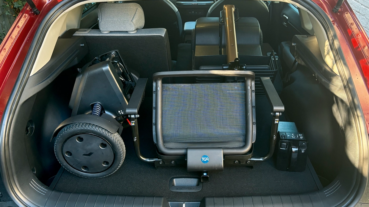 a-mobility-scooter-foldeed-and-stowed-inside-the-boot-of-a-kia-ev4.webp
