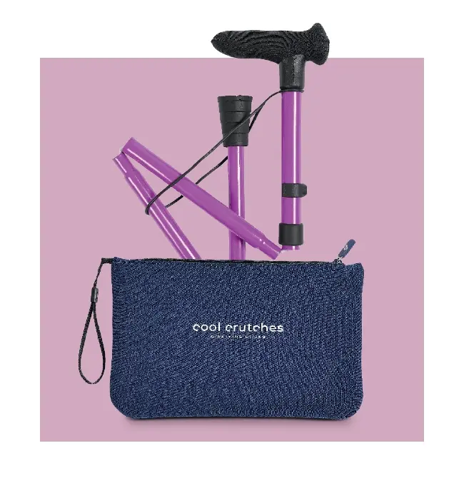 A detailed image of a pink folding walking stick and its travel bag over a pink background
