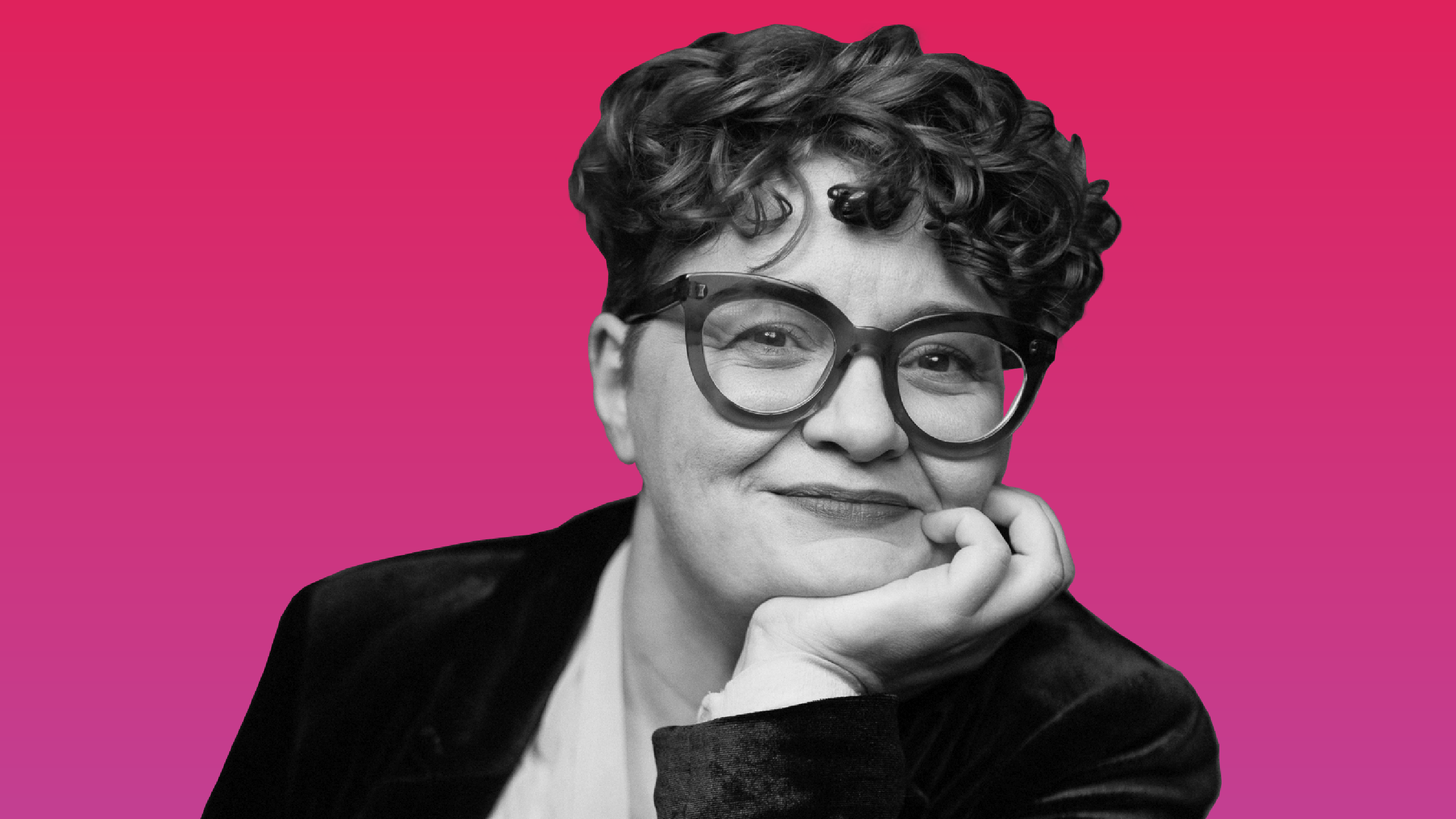 Photo of Hannah in front of a pink background