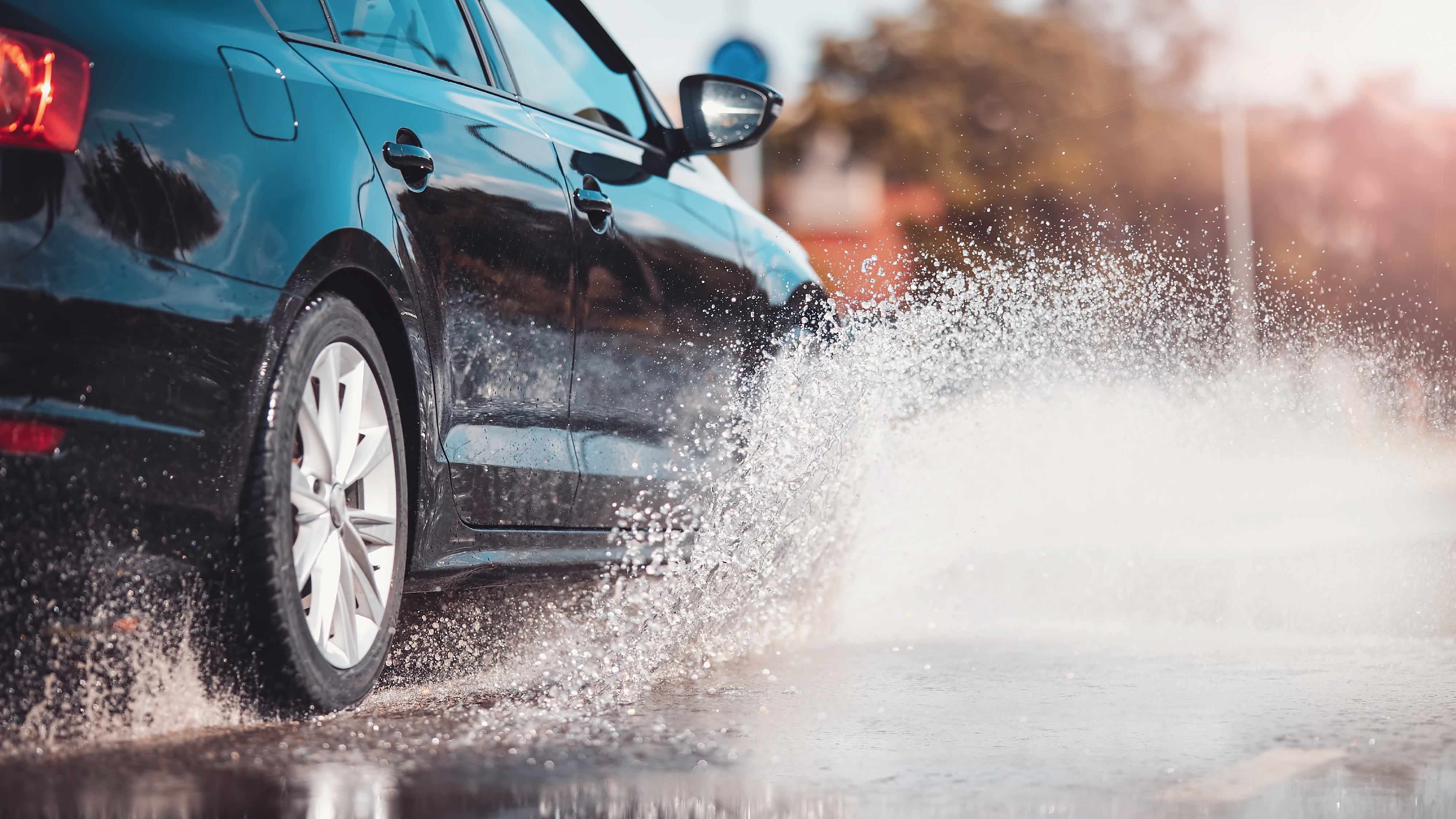 A car driving through a puddle