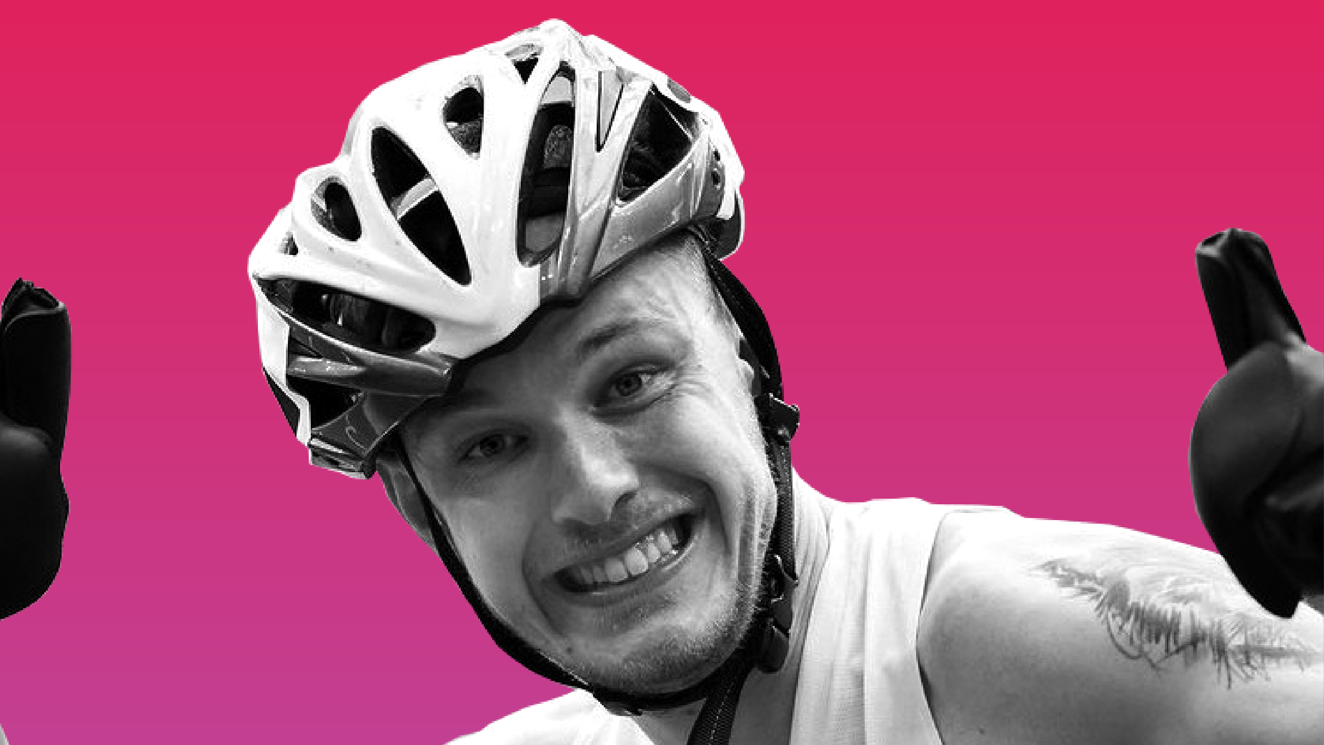 Photo of James in front of a pink background