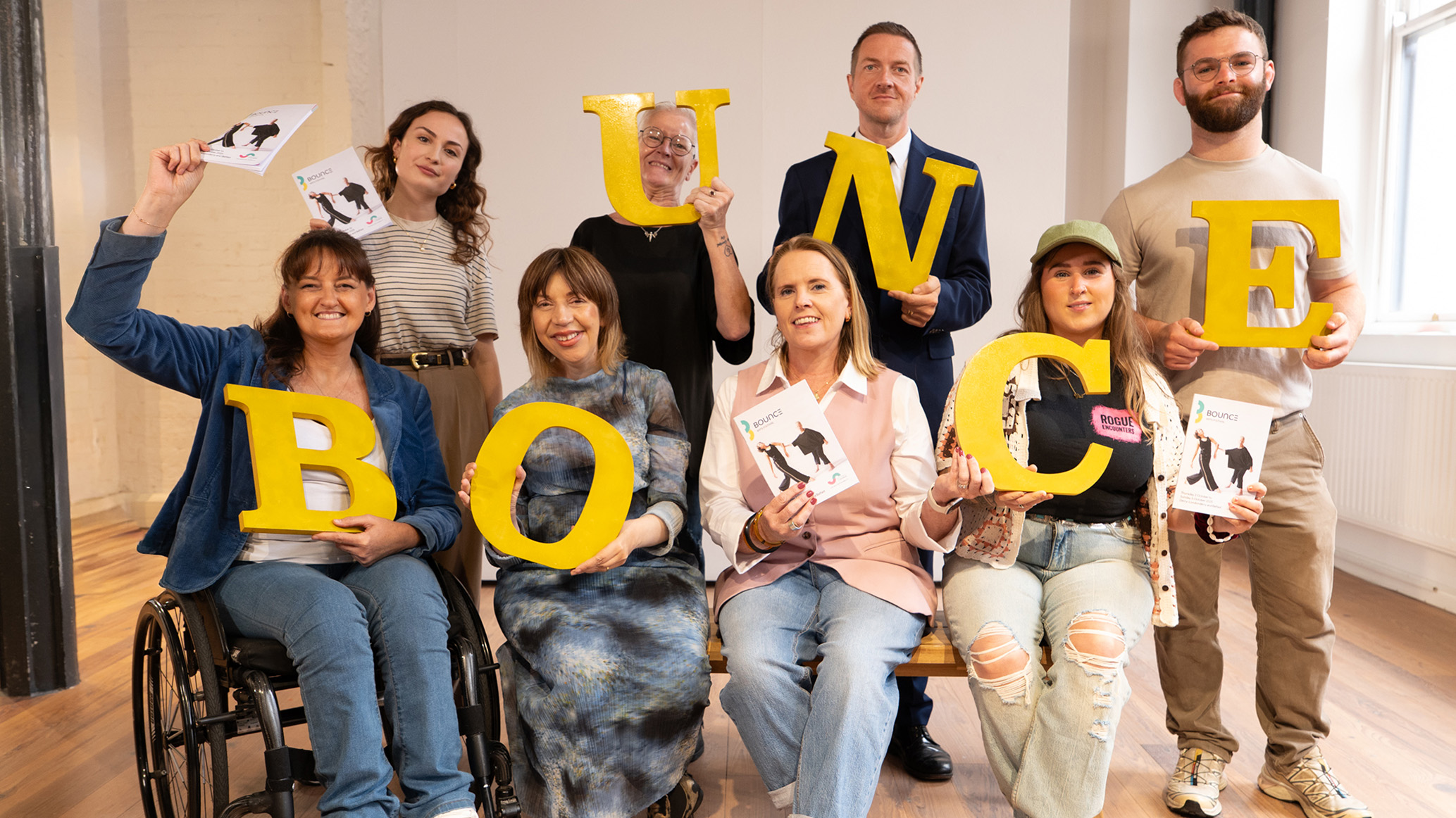 Photo of people holding up letters which make up the word 'Bounce'