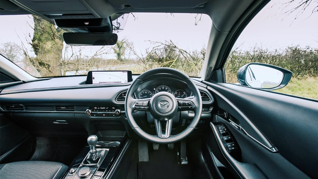 the-interior-steering-wheel-view-of-the-Mazda-CX-30.webp