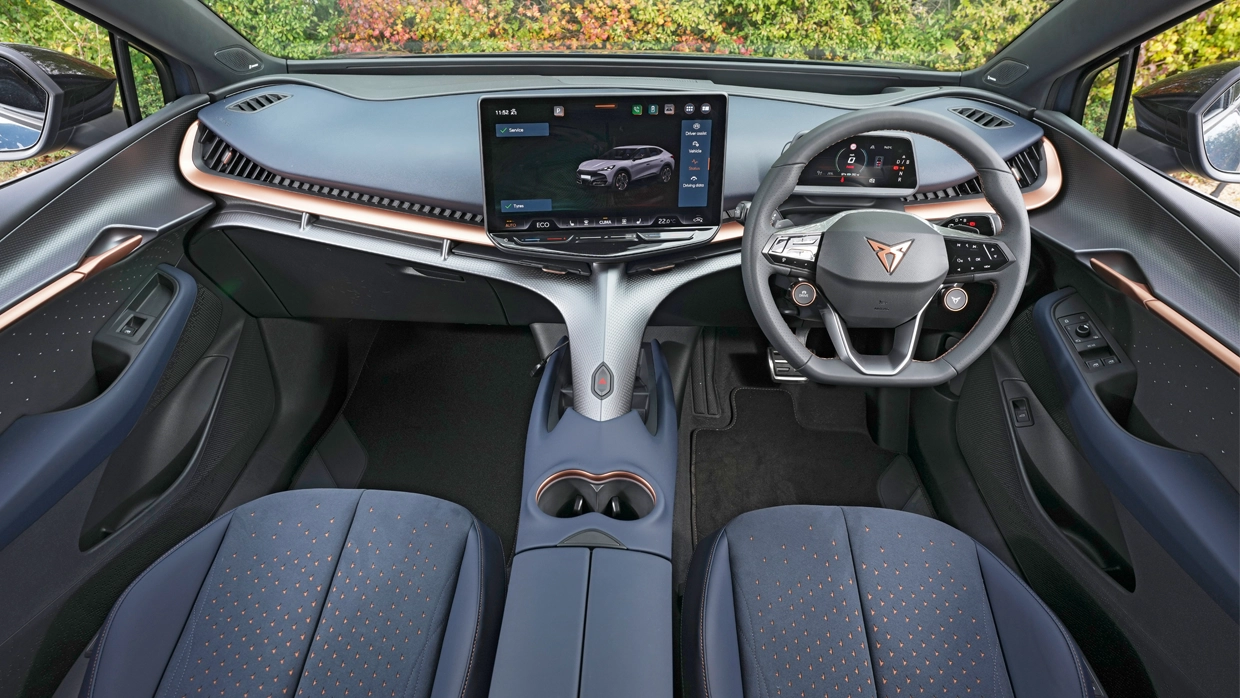 the-steering-wheel-and-dashboard-view-inside-the-cupra-tavascan.webp