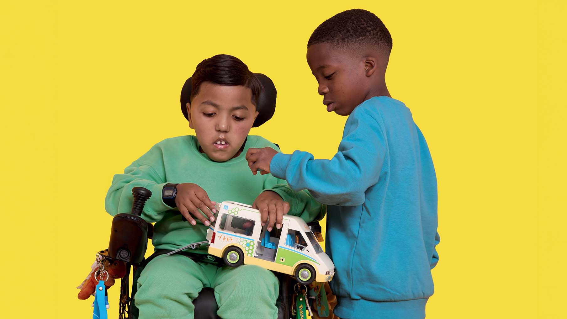 two-young-boys-noah-pictured-left-a-wheelchair-user-and-king-pictured-right-a-non-wheelchair-user-both-boys-are-playing-with-inclusive-toys.jpg
